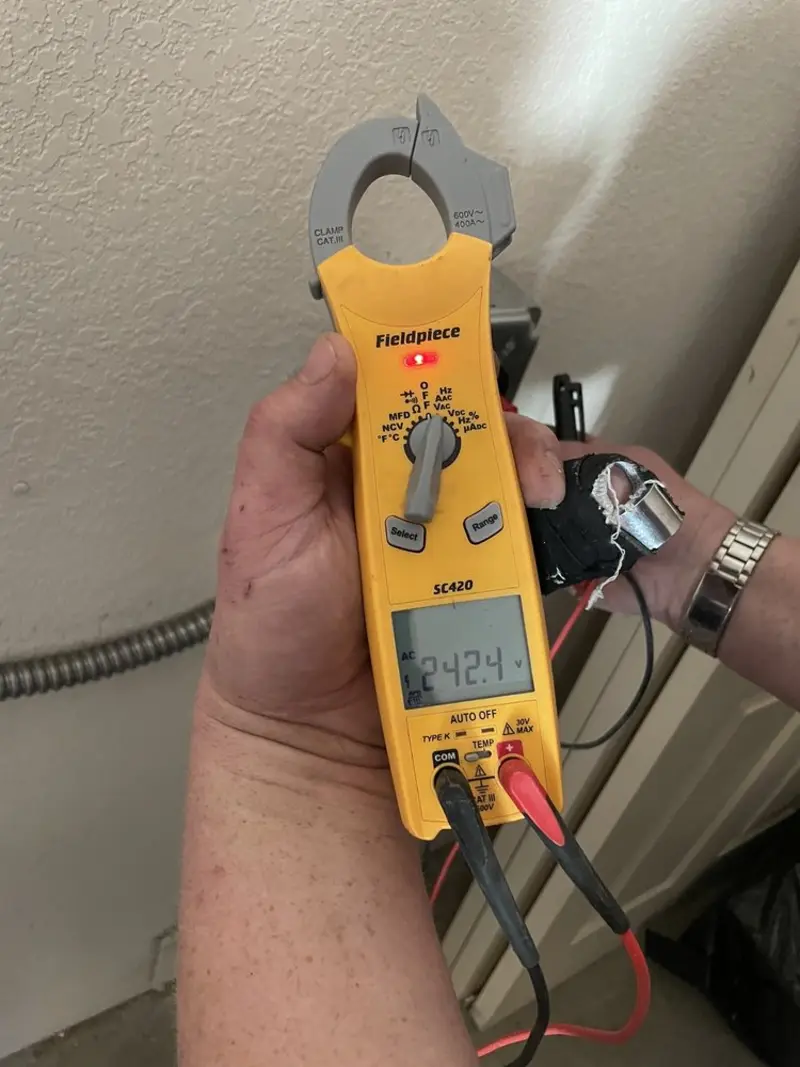 Voltage testing with clamp meter during Ceiling Fan Installation in Kings Grant